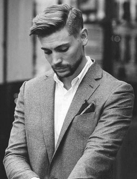 A sharply styled men's haircut and groomed look — the Refined Gents standard