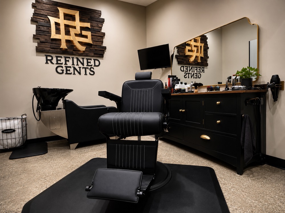 Barber chair and product station inside the Refined Gents men's grooming studio in Plano, Texas